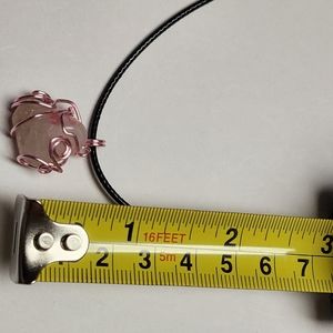 Handmade wire wrap stone pendant with cord.